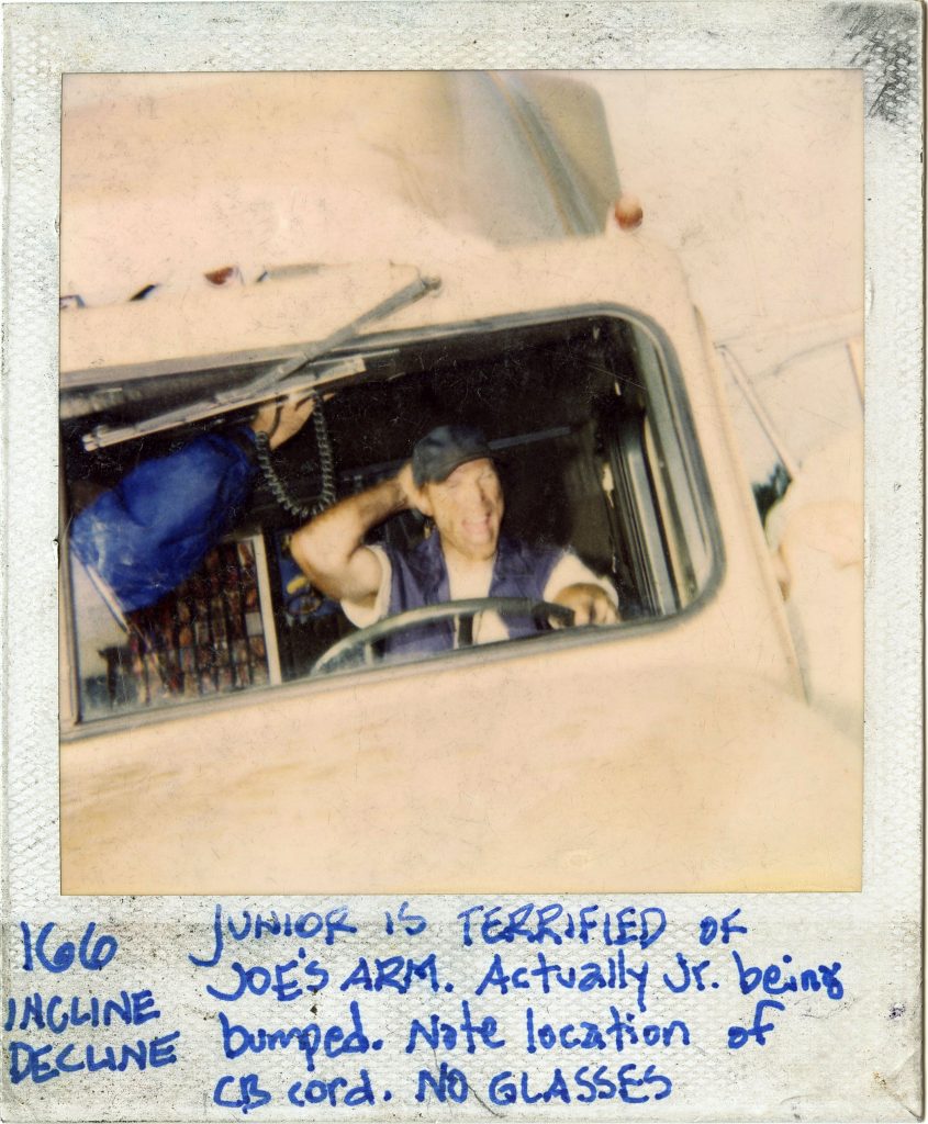 A polaroid continuity photo showing the placement of the CB radio cable in front of a stunt actor. This was taken during a day when we shot poor man's process of these drivers reactions.